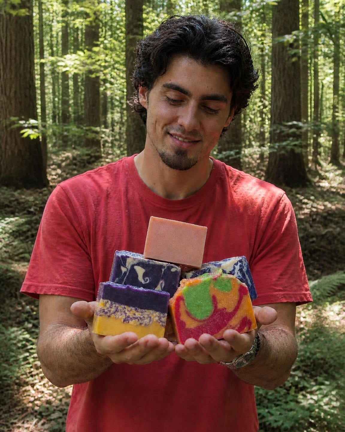 Ethan holding Aura & Wellness goat milk soaps