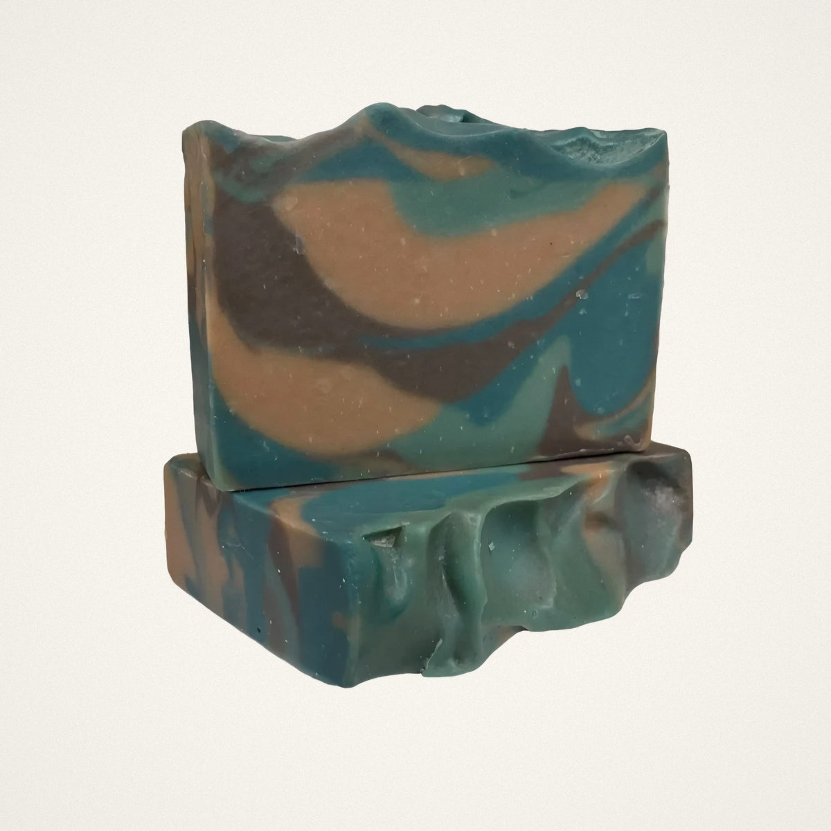 Camo Woods goat milk soap bars with teal, tan and brown swirls