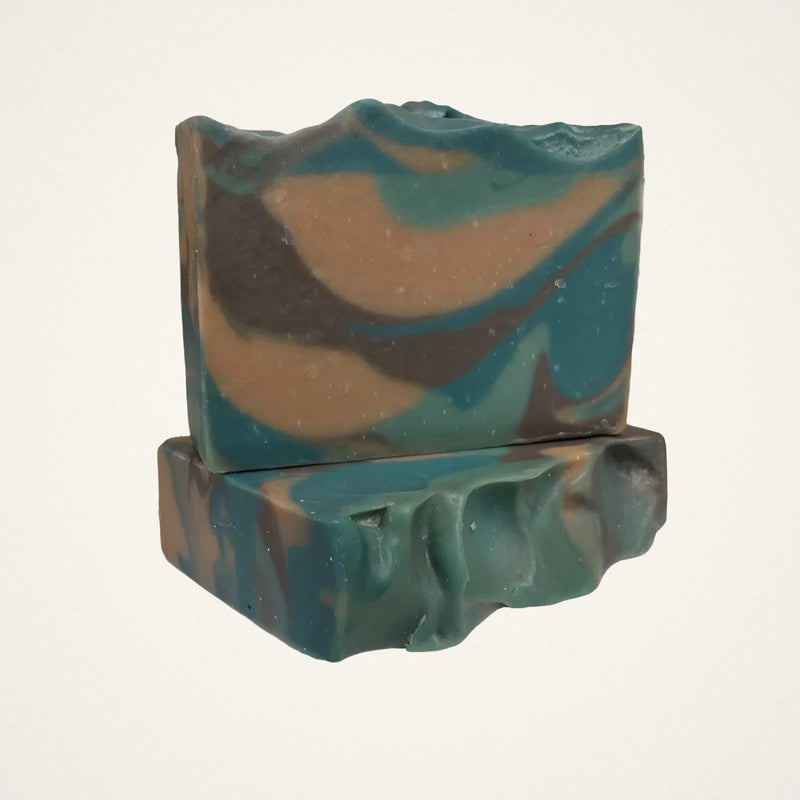 Camo Woods goat milk soap bars with teal, tan and brown swirls