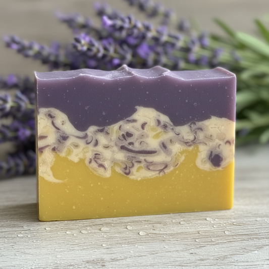 Close-up of Wildberry goat milk soap showing purple, cream and yellow layers