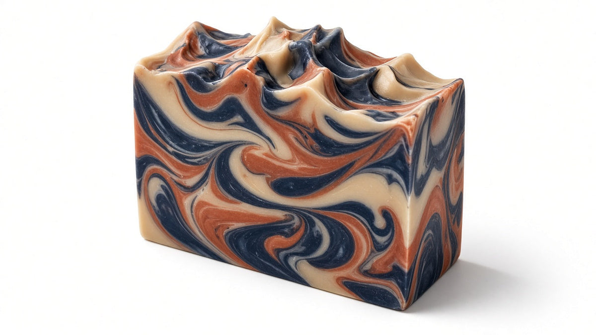 Perfect Man Cologne goat milk soap bar with navy and copper swirls, angled view
