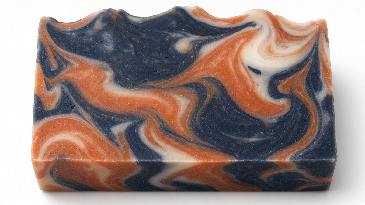 Perfect Man Cologne goat milk soap bar with navy, orange and cream swirl pattern